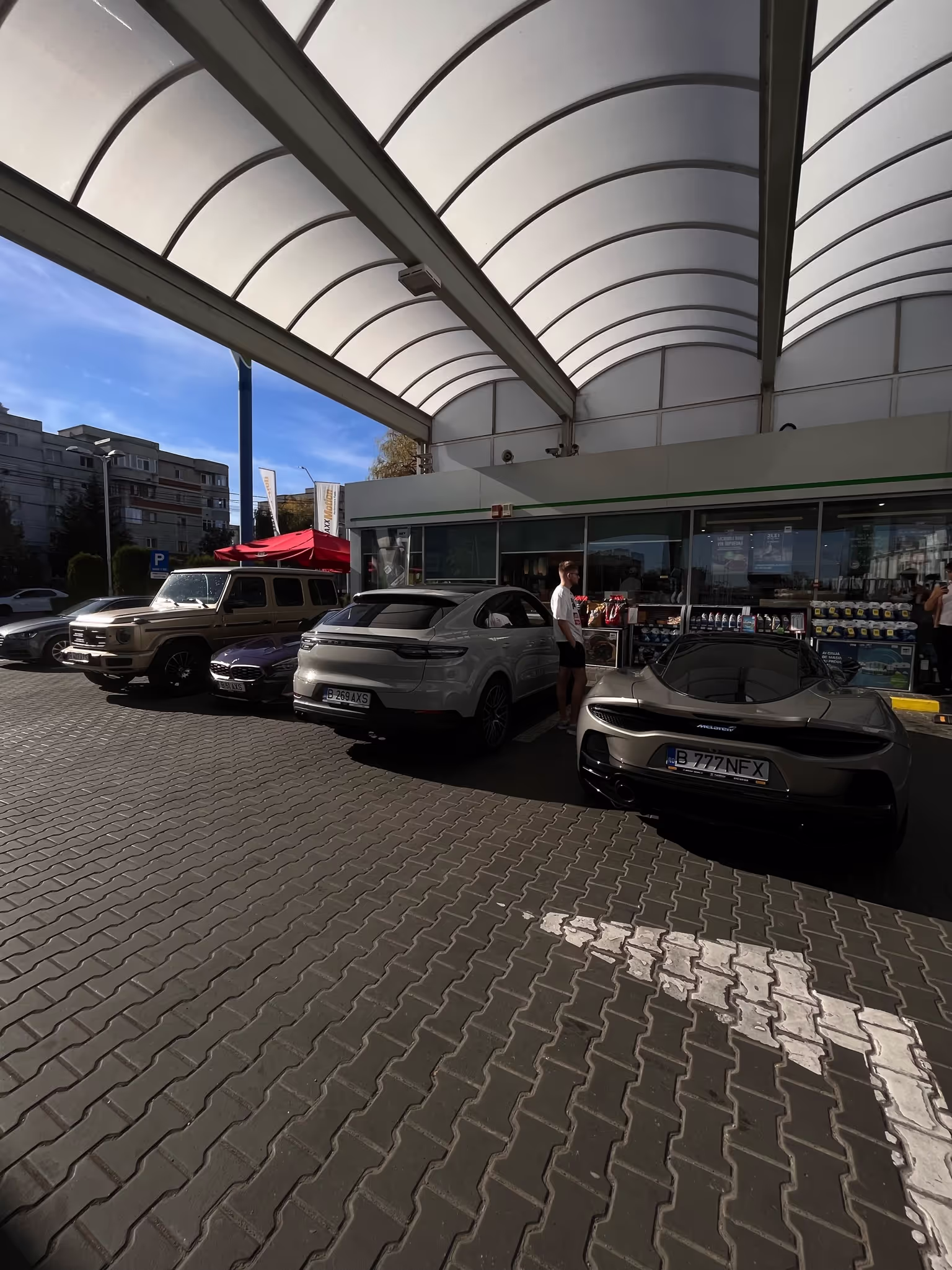 Helix members arriving by car convoy at a Bucharest venue