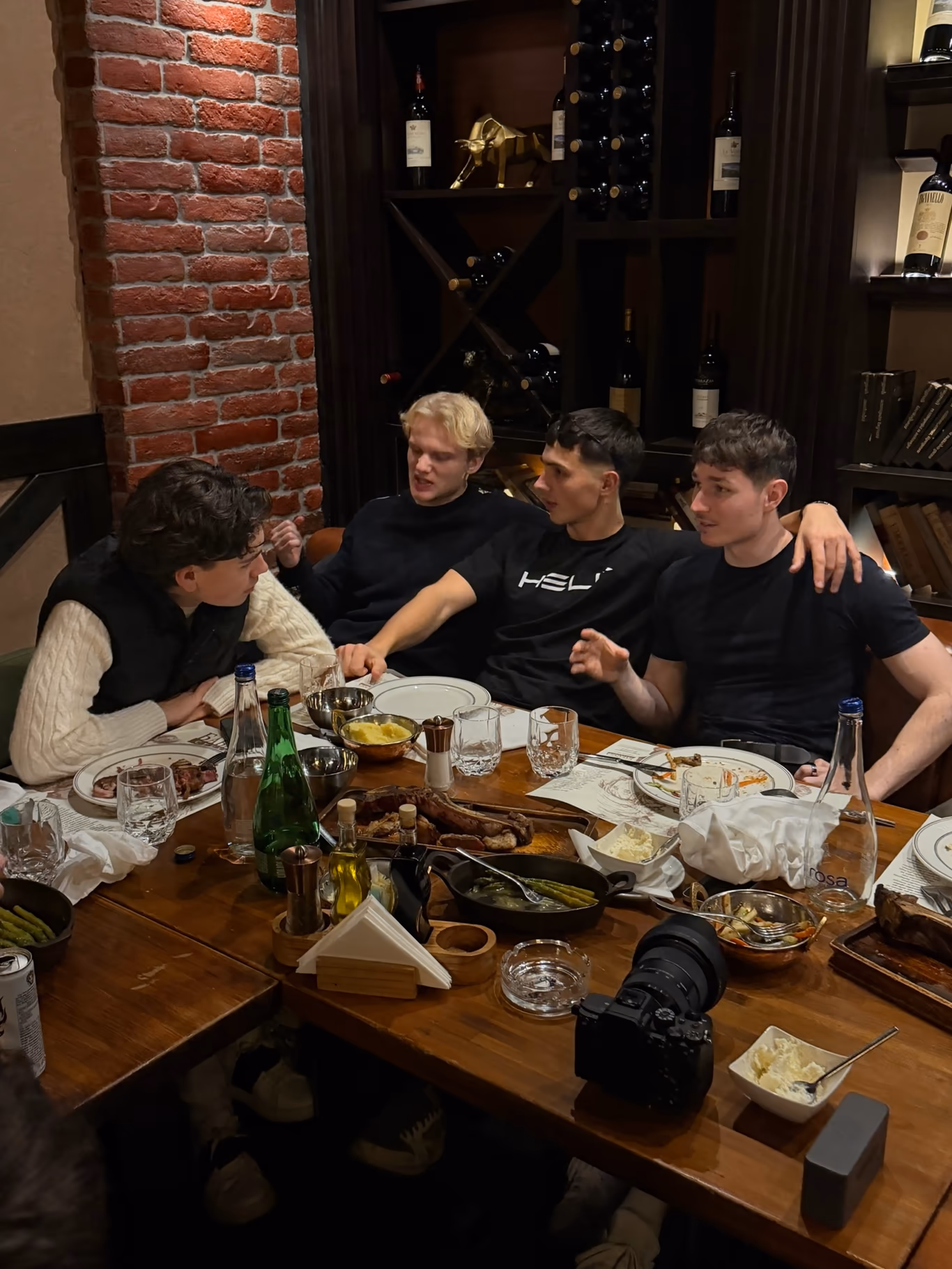 Founders sharing a relaxed dinner and a bottle of wine — friendship built over the table
