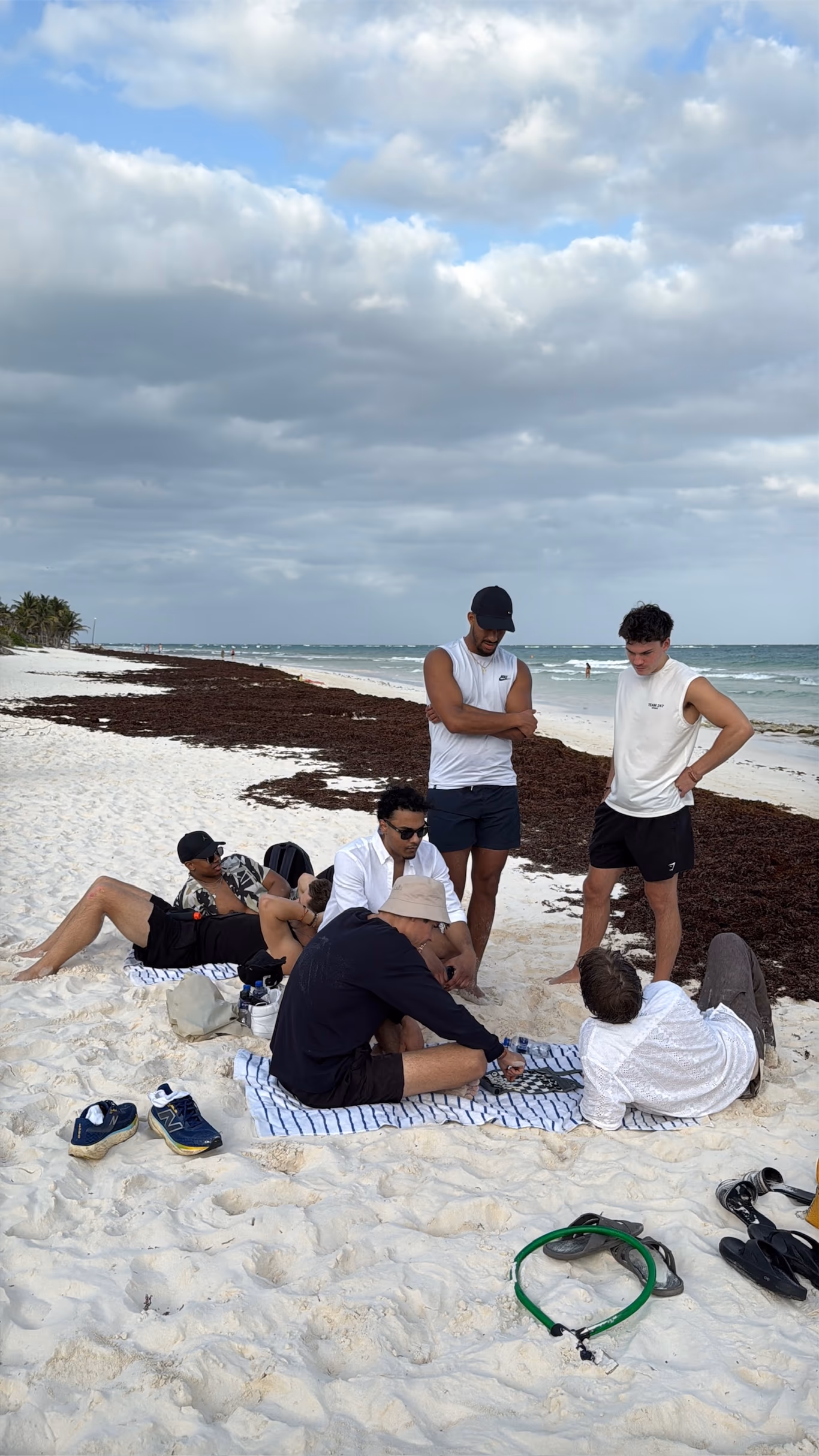 Founder loneliness — the cure is company that gets it Founders standing together on a beach looking out to sea — the antidote to founder loneliness