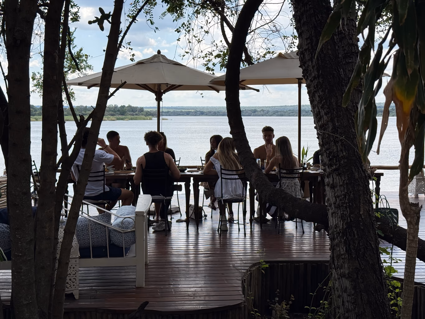 Founder support system — the people in your corner Founders around a table by the water — the four kinds of support in one room