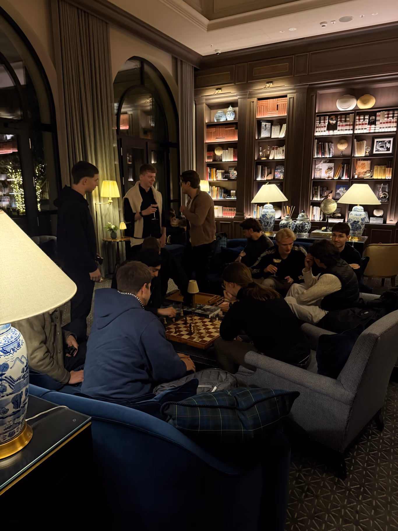 Founders at ease in a low-lit lounge — the quiet proof that you belong in the room